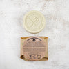 Battle Green Mint Conditioner Bar with bar on display with a fully wrapped bar. the packaging is compostable and printed with plant based ink. handmade in small batches, palm oil free, PETA certified Cruelty-Free & Vegan.