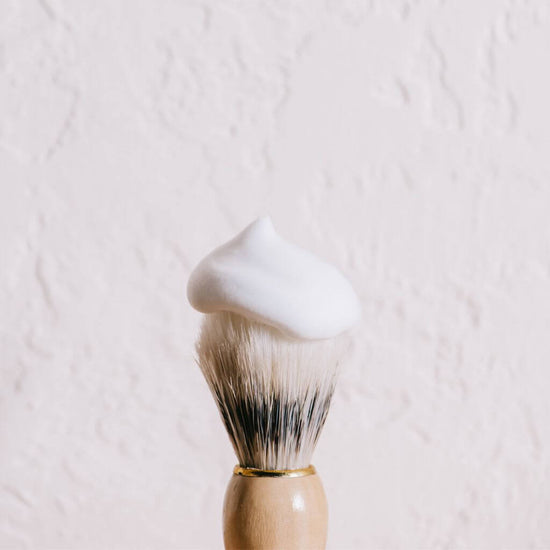 Acala Natural Shaving Brush being used with shaving foam. white background. economy priced.