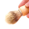 Acala Natural Shaving Brush, light wooden handle, with a metal ring leading to natural light coloured brissles.