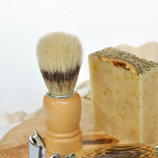 Acala Natural Shaving Brush for use when shaving. Wooden handle with trimmed brush strands of naturally sourced boar hair.