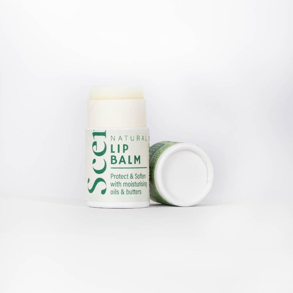 Scence Jojoba Pure essential oil free natural Lip Balm. Lid Off on White Background. Perfect for Dry lips and people with sensitive skin or wanting to avoid essential oils and fragrances.. Wonderful Scent. Size: 8.5 grams