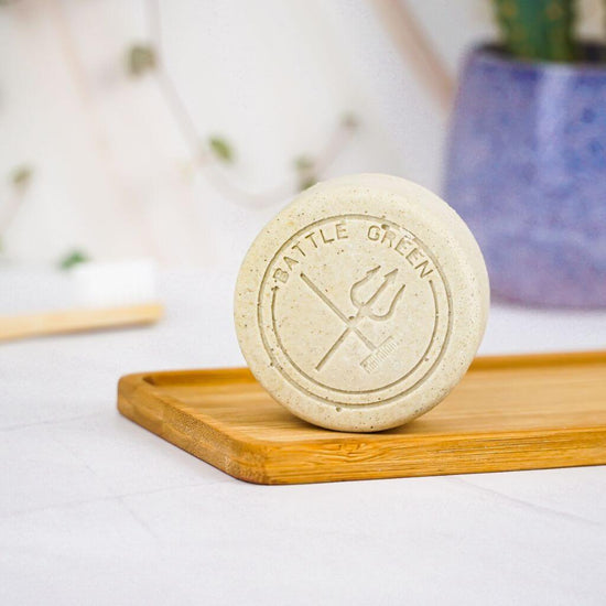 Battle Green Chamomile Vegan Natural Deodorant Bar. natural ingredients. on a bamboo board with deodorant bar standing up. plastic free.