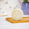 Battle Green Chamomile Vegan Natural Deodorant Bar. natural ingredients. on a bamboo board with deodorant bar standing up. plastic free.
