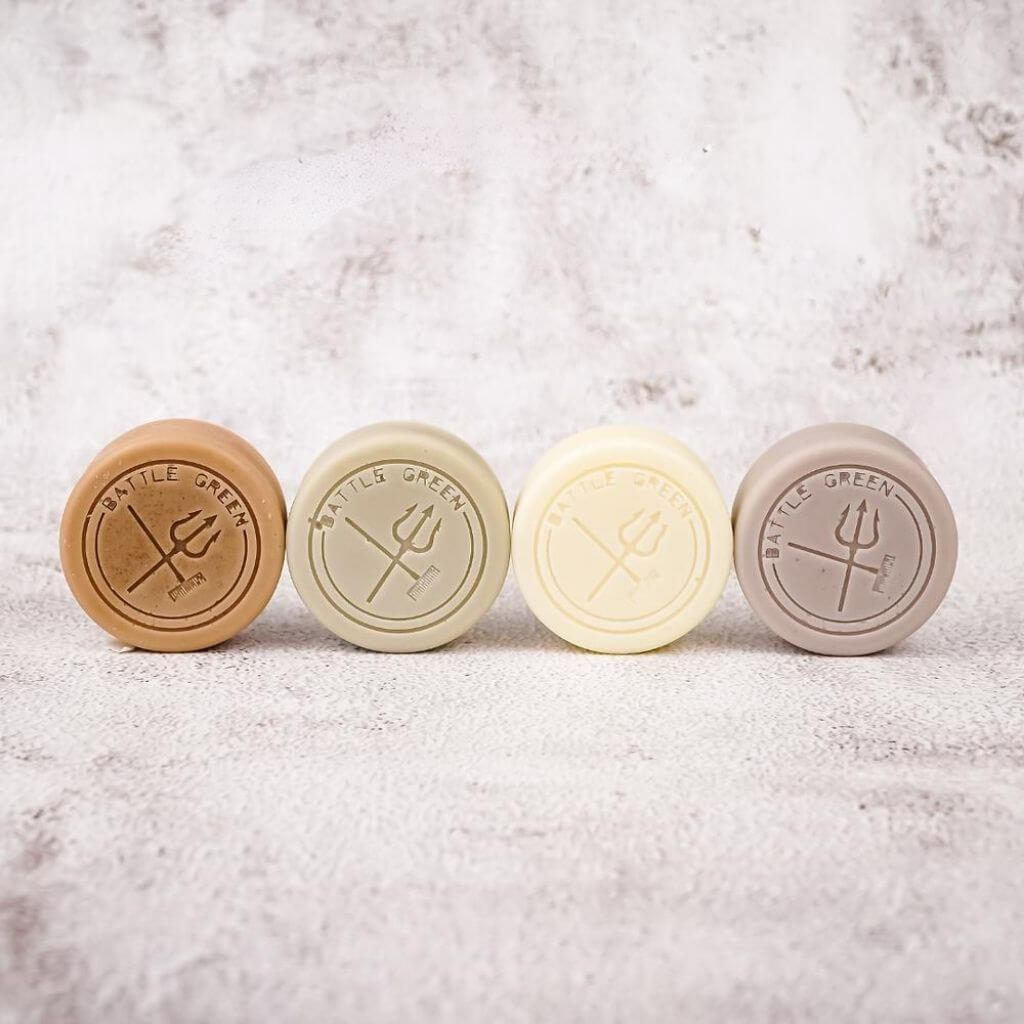 Battle Green Lavender Solid Hair Conditioner Bar. on display with other conditioner bars. affordable and effective way to condition your hair.