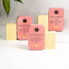 The Edinburgh Natural Skincare Co. Golden Rosewood Solid Hand Cream Bar. On a shelf in a lifestyle display.