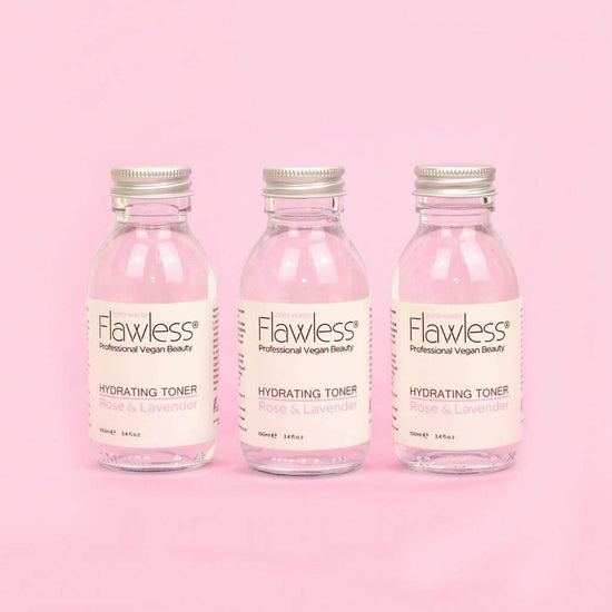 Flawless Professional Vegan Beauty Toner - Rose and Lavender. Three glass jar with aluminium lid on pink background.
