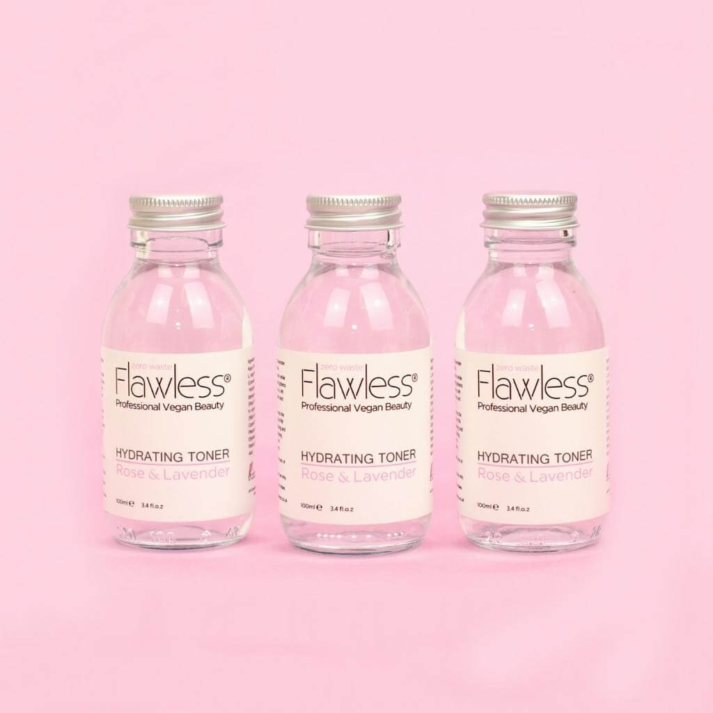 Flawless Professional Vegan Beauty Toner - Rose and Lavender. Three glass jar with aluminium lid on pink background.