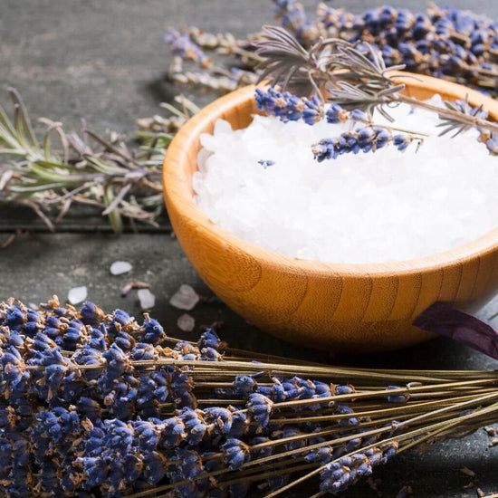 Flawless Professional Vegan Beauty Relaxing Bath Salts - Sweet Dreams in a wooden bowl, ready to be used. with visible Lavender dried flowers.