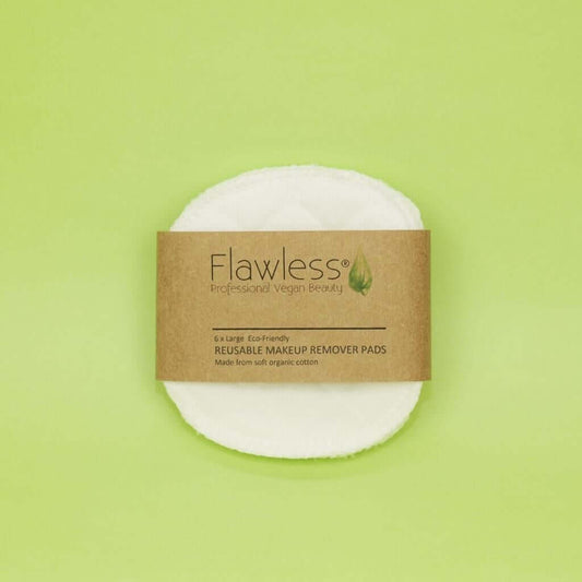 Flawless Professional Vegan Beauty Reusable Organic Cotton Makeup Remover Pads. Pack of face pads. On a green background.