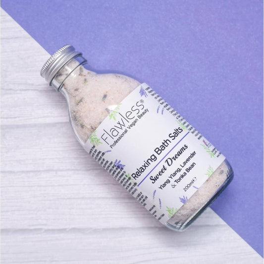 Flawless Professional Vegan Beauty Relaxing Bath Salts - Sweet Dreams. on side with half blue, half wood background.