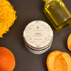 Silvan Skincare. Pure Face Cream. 50ml. Lifestyle image. Apricot and Olive Oil. Calendula Marigold Flower. Vegan Leaping Bunny Approved.