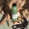 UpCircle Bath Salts with Epsom, Sea and Himalayan Pink Salt, and Rose Petals. Lifestyle Image. With Salts and Driftwood.