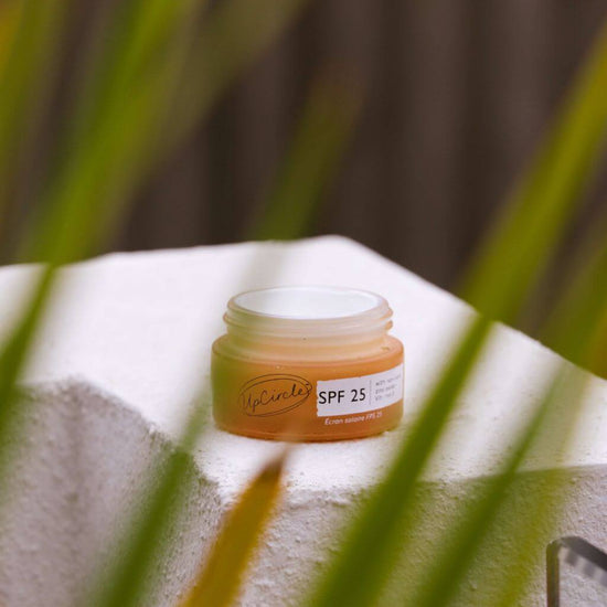 pCircle - SPF 25 Mineral Sunscreen with non-nano zinc oxide and Vitamin E. Travel Size 20ml. Lifestyle product image. Outside with lid off.