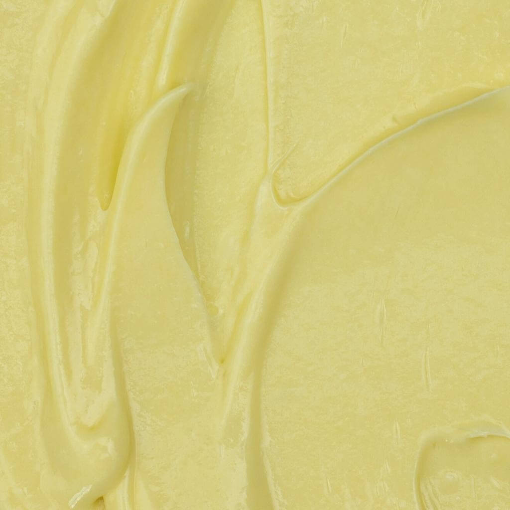UpCircle - Night Cream texture photo shot. The product is cream coloured and thick.