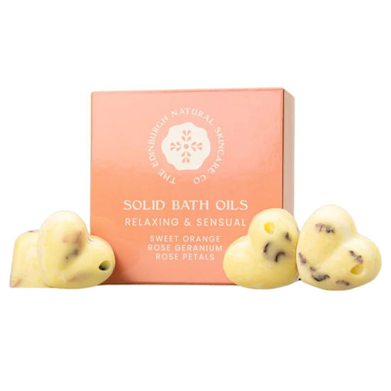 The Edinburgh Natural Skincare Co. Sweet Orange and Geranium Solid Bath Oils. Pack of four on display outside box. Sweet Orange Rose Geranium Petals.