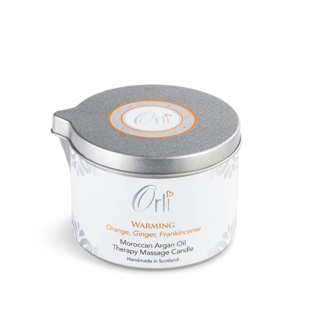 Orli Warming Therapy Massage Candle. Hand made in Scotland. With Orange, Ginger and Frankincense. Nourishing and warming. in an aluminium tin with spout. Suitable for all skin types. Vegan and Cruelty free.