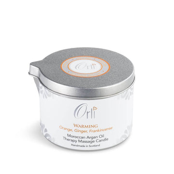 Orli Warming Therapy Massage Candle. Hand made in Scotland. With Orange, Ginger and Frankincense. Nourishing and warming. in an aluminium tin with spout. Suitable for all skin types. Vegan and Cruelty free.