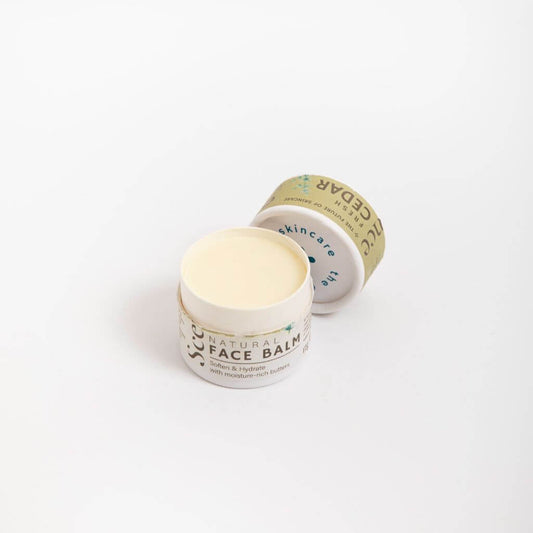 Scence Fresh Cedar Natural Solid Face Balm. Lid Off on White Background. Perfect for Dry Skin. Wonderful Scent. Size: 35 grams