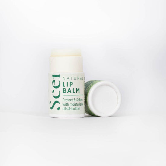 Scence Jojoba Pure essential oil free natural Lip Balm. Lid Off on White Background. Perfect for Dry lips and people with sensitive skin or wanting to avoid essential oils and fragrances.. Wonderful Scent. Size: 8.5 grams