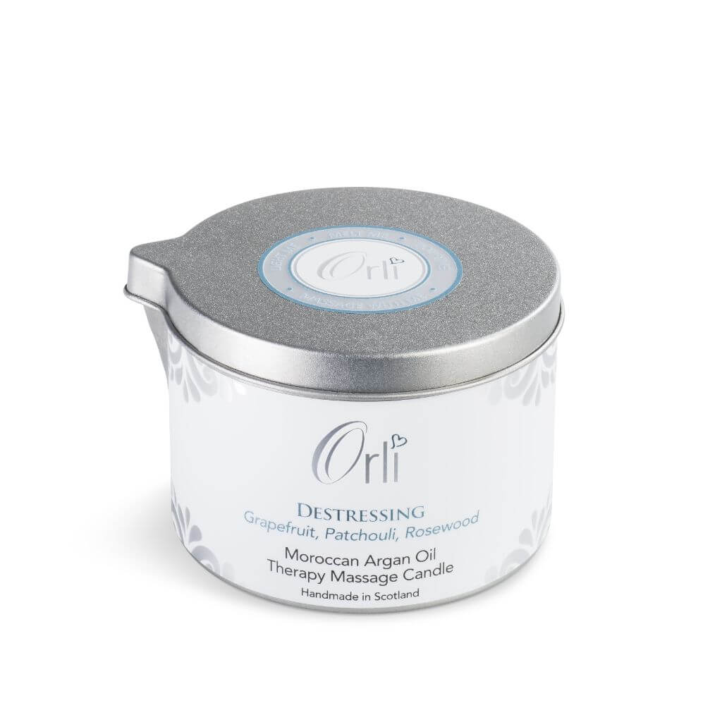 Orli Destressing Therapy Massage Candle in Aluminium tin. Jojoba, Sweet Almond and Moroccan Argan Oil, scented with a special blend of Grapefruit, Patchouli and Rosewood. Handmade in Scotland. White Background.