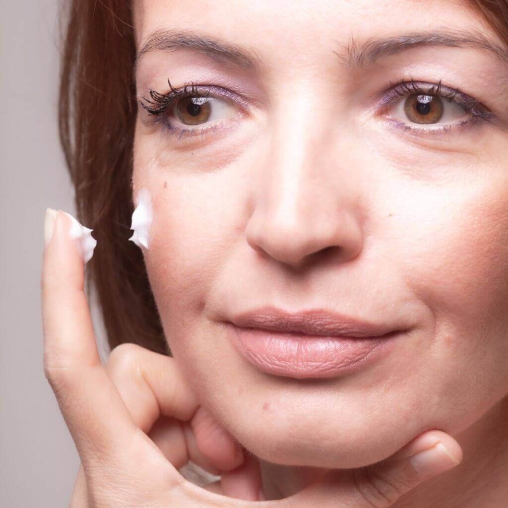 Silvan Skincare. Face Cream. Rejuvenate for Mature Skin. Cream being applied to mature woman's face, allow the special ingredients to do their work and look after your special skin.