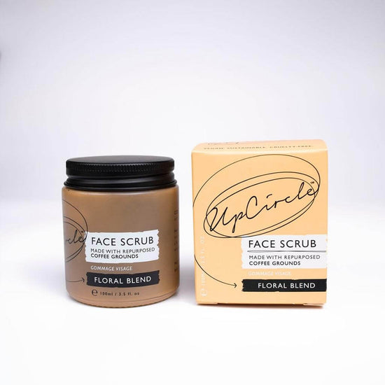Upcircle Face Scrub Floral Blend with Jar and Cardboard Box fronts visable. Face Scrub made with repurposed coffee grounds. With a white background.