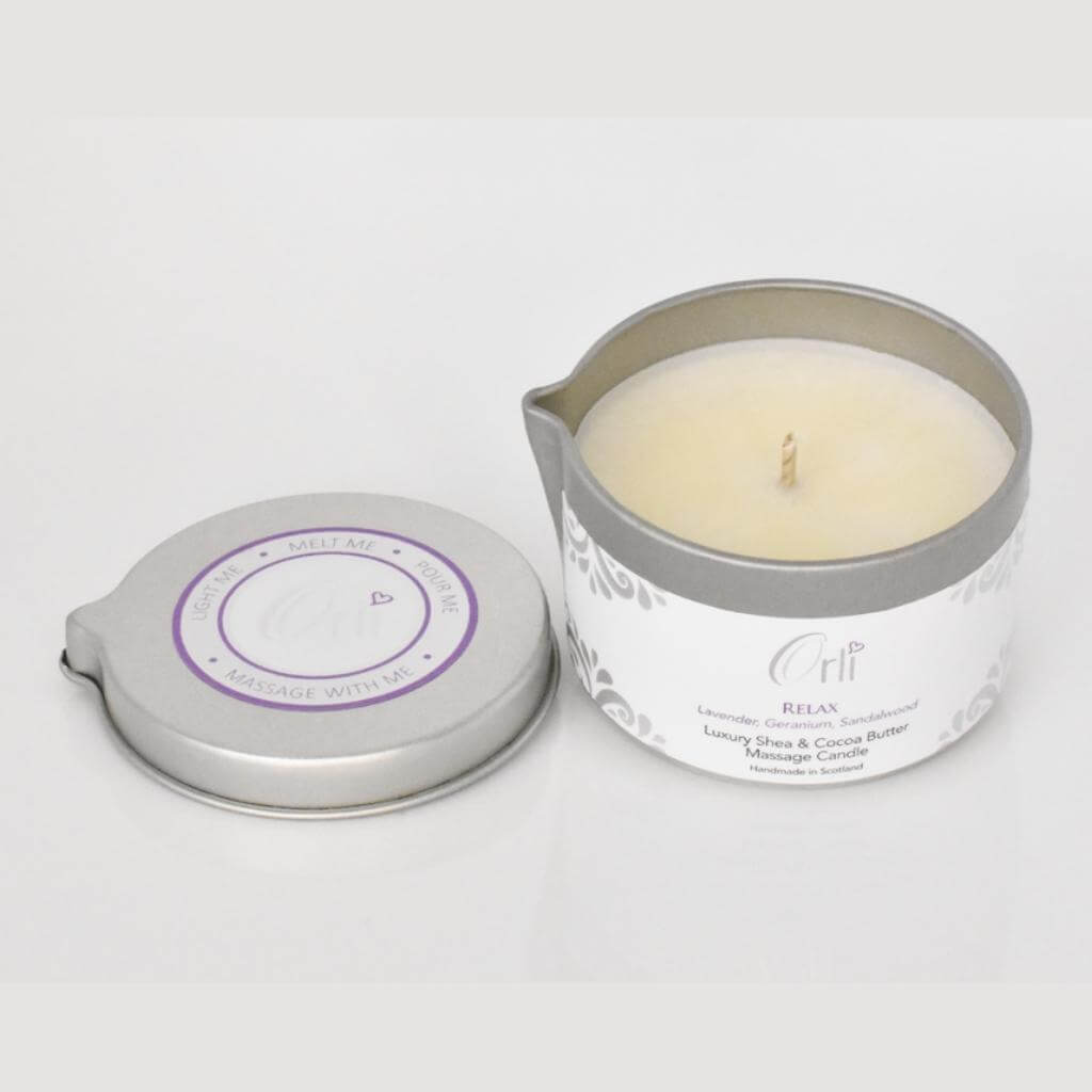 Orli Relax Therapy Massage Candle with aluminium tin. Relax. Lid Off and open on white background. Candle ready to light.