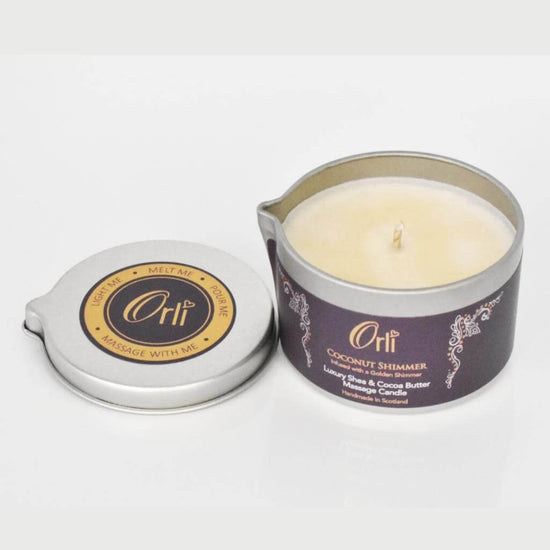 Orli Coconut Shimmer Massage Candle in Aluminium tin. Lid Off on white background.
