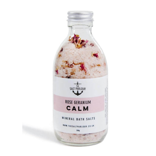 The Salt Parlour - Rose Geranium CALM Mineral Bath Salts glass bottle with aluminium lid. The salts show the rose petals inside.
