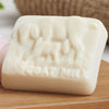 Goats of the Gorge Goats milk and Geranium Soap. Natural and beneficial to your skin. High in Vitamin A and Retinol. on wooden board.