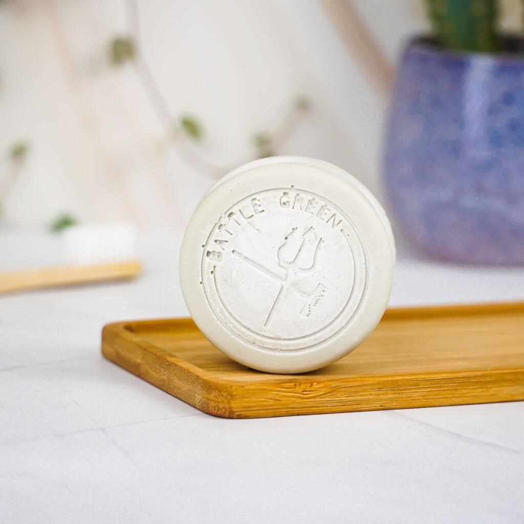 Battle Green Lavender & Tea Tree Vegan Natural Deodorant Bar. Vegan. on a bamboo board with deodorant bar standing up. plastic free. Travel Friendly.