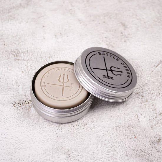 Battle Green Lavender Solid Hair Conditioner Bar. with the bar in the travel tin. House your conditioner bar in this handy Travel Tin to keep your bar dry, protected and hygienic.