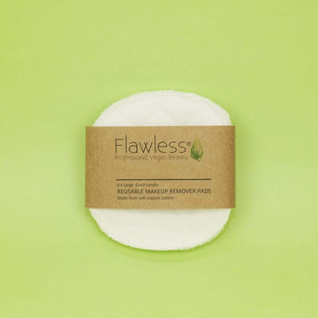 Flawless Professional Vegan Beauty Reusable Organic Cotton Makeup Remover Pads. Pack of face pads. On a green background.