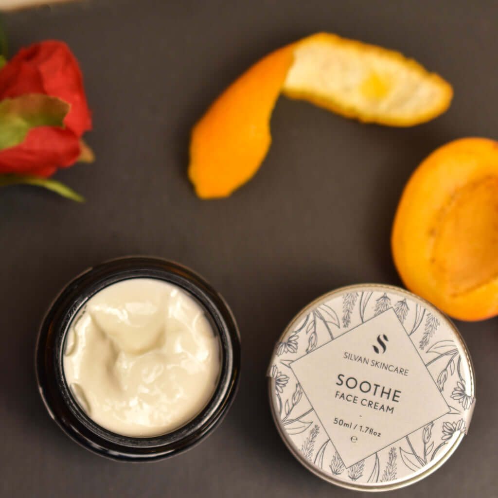 Silvan Skincare. Soothe Face Cream. 50ml. Lifestyle Image with mandarin peel and rose.