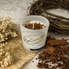 Upcircle Chai Latte Natural Soy Candle. Product with additional chai spices in top of candle and chai ingredient on display. Cinnamon, Star anise, cardamom.