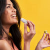 Scence Natural Berry Sorbet Lip Balm. Lip Balm application on models Lips. Yellow Background.