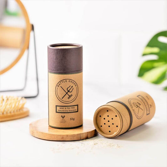 Battle Green Mint & Tea Tree Dry Shampoo Shaker Pot. Display with 2 pots. one with lid off showing the top of the cardboard tube, and one with lid on. Great for traveling and to boost volume in your hair.