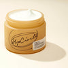 Upcircle Face Moisturiser jar with lid off and the creamy white product showing through the top.