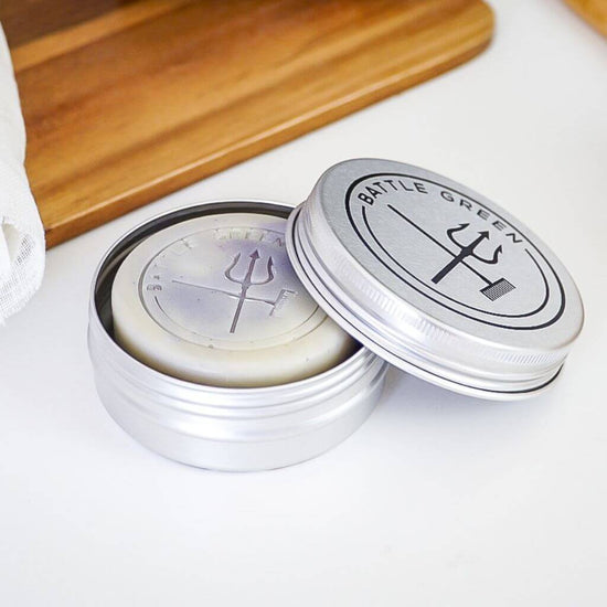 Battle Green Lavender & Tea Tree Natural Vegan Shampoo Bar. shampoo bar in travel tin on display. perfect fit for the travel tin, and to keep the shampoo safe and dry.