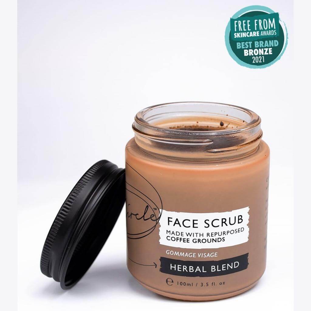 Upcircle Face Scrub Herbal Blend with lid off jar. Awards: Free From Skincare Awards Best Brand Bronze 2021.