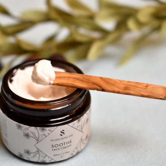 Silvan Skincare. Soothe Face Cream. 50ml. product scooped with olive wood cosmetic spatula. for sensitive skin and all skin types.