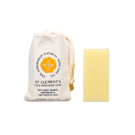 The Edinburgh Natural Skincare Co. St Clement’s Cold Processed Soap. With Cotton bag and Cold Processed Soap on display with white background.