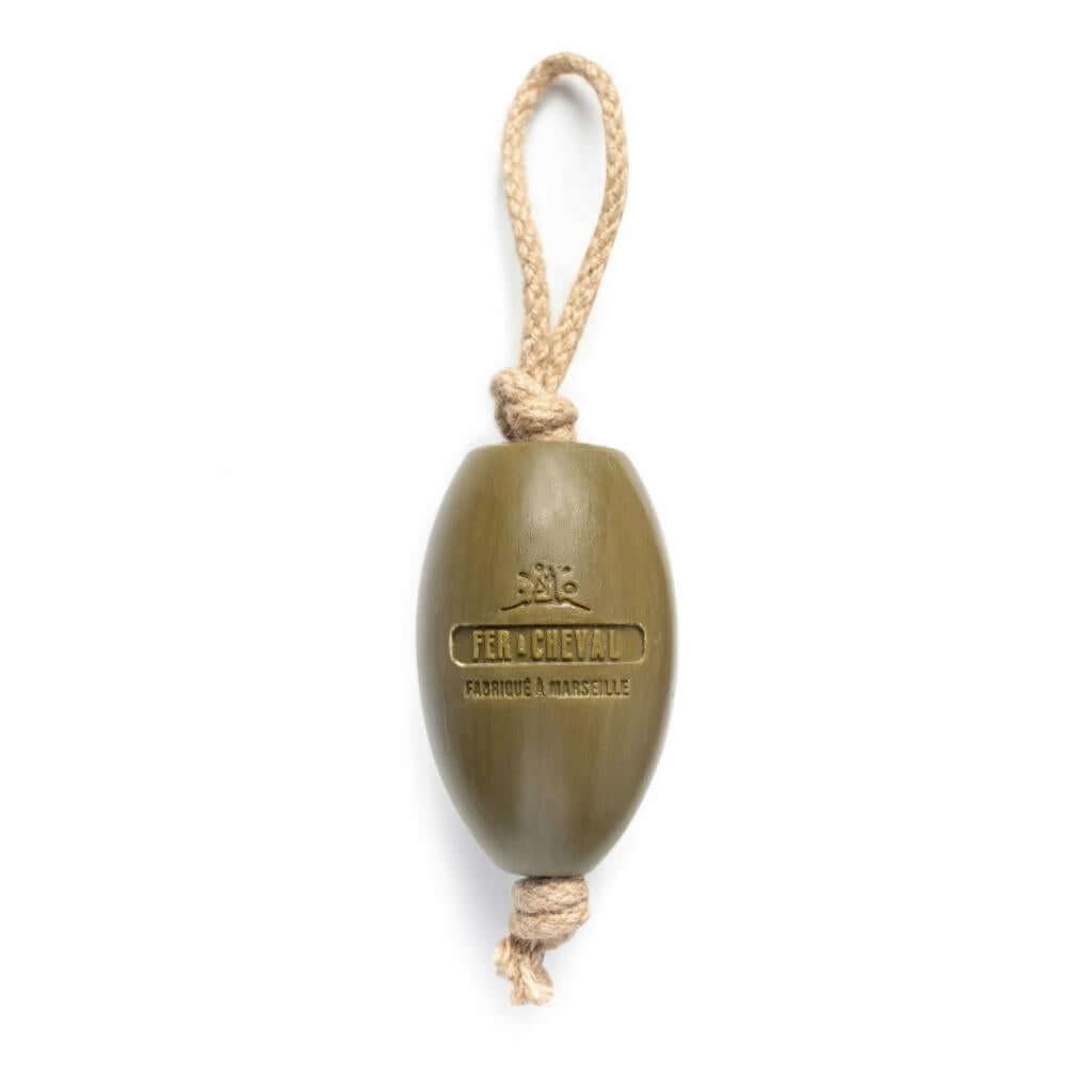 Fer à Cheval Olive of Marseille Soap on a Rope. Olive shaped soap with natural fibre rope through the centre on a white background.