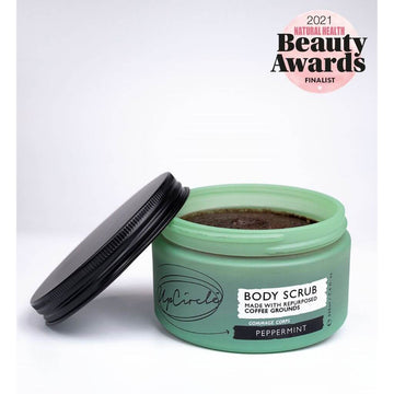 Upcircle Body Scrub containing Peppermint with lid off and coffee grounds scrub visible on a white background. Awards: Beauty Shortlist Awards 2021 Editor's Choice