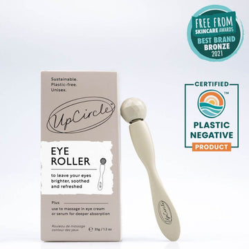 UpCircle Eye Roller, with Cardboard Box. Upright with white background. Award Winning Free From Skincare Awards. Best Brand Bronze 2021. Certified Plastic Negative Product.
