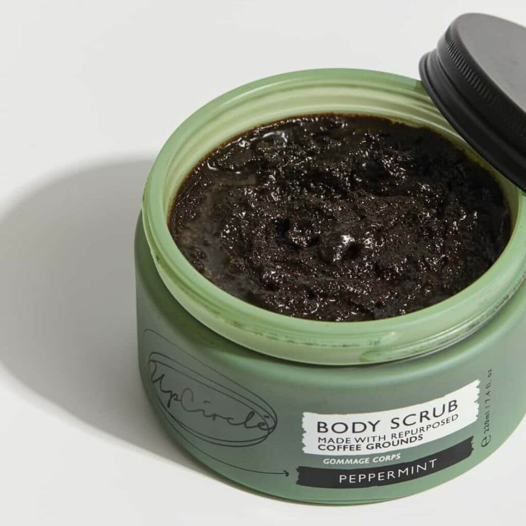 Upcircle Body Scrub containing Peppermint with the lid off and scrub visible.