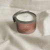 Orli Hair Treatment Candle - For Women in Aluminium tin. Display with natural cotton wrap. Lid off and product visible. Easily turns to amazing massage hair care oil.